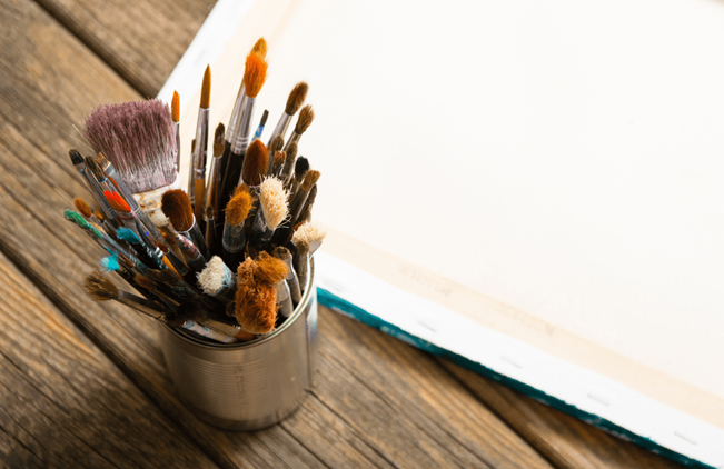 artists brushes on a desk