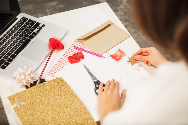 girl making a love card