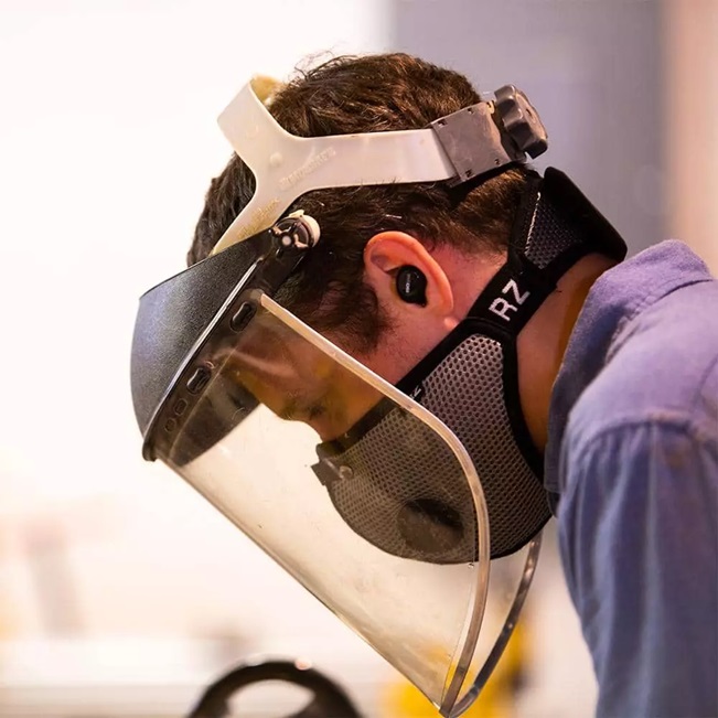 a woodworking worker with personal protective equipment