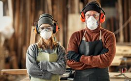 two woodworking workers standing next to eachother