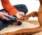 person using a pet nail grinder in australia